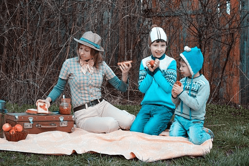 kids having a picnic on a family camping trip