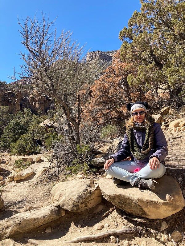 woman sitting in a rock in utah