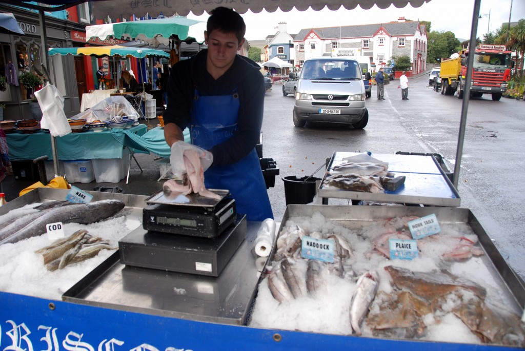 A man selling some fish in a local market
