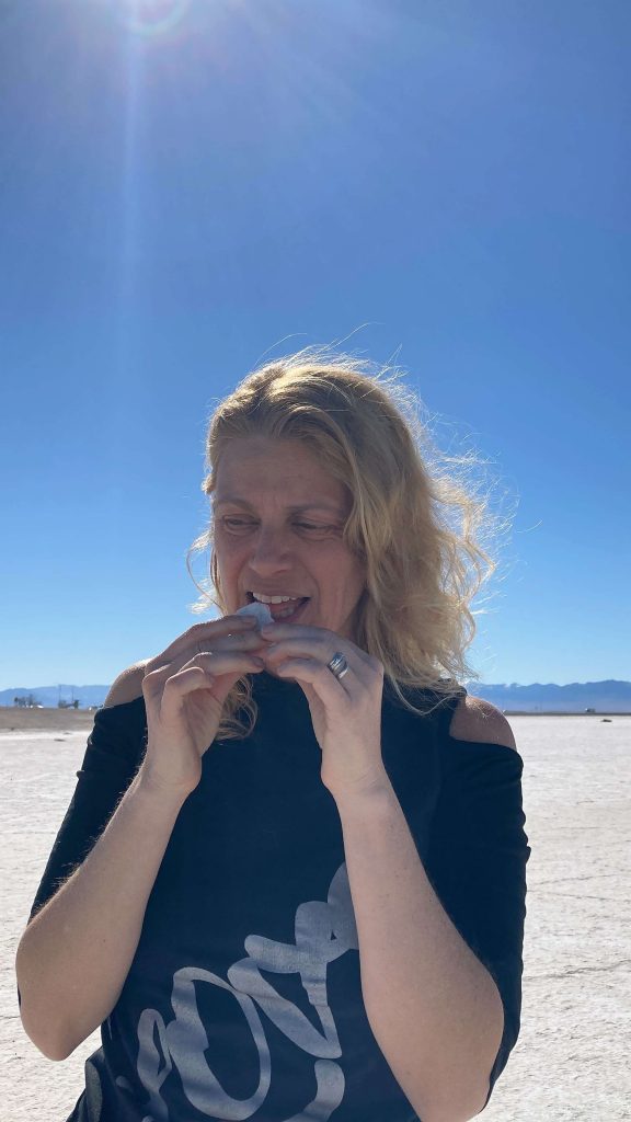 woman eating salt at the Bonneville Salt Flats