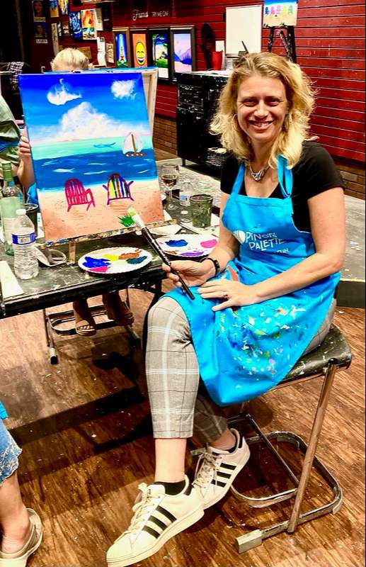 woman in a paint and sip wine class