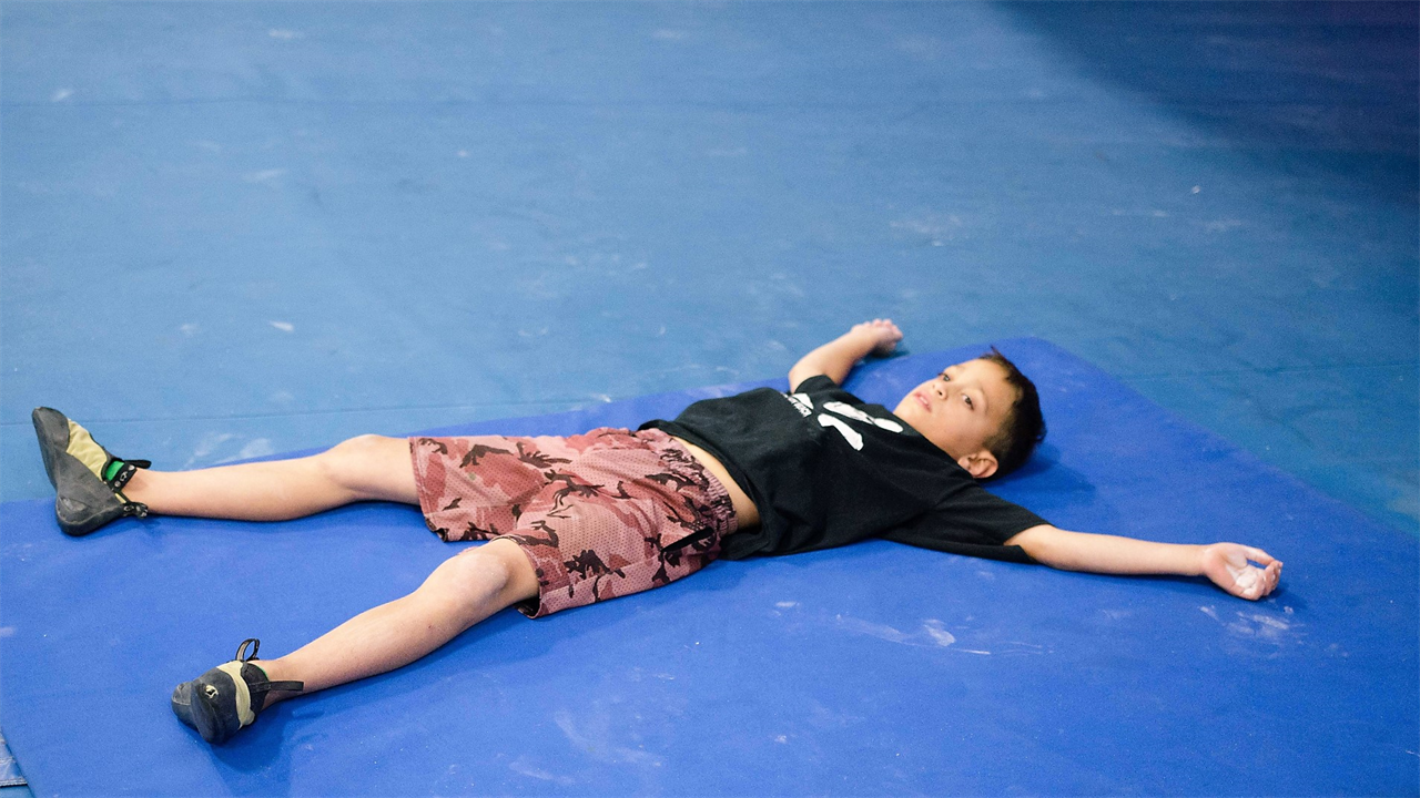 kid laying on the floor