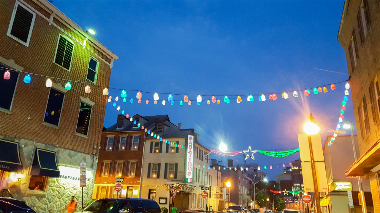 street lights and buildings at little italy in baltimore