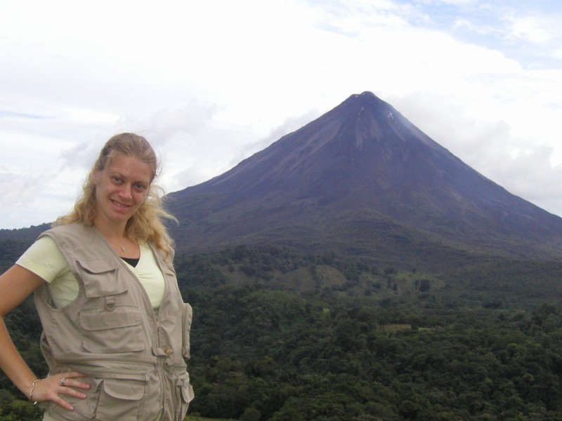 woman in front of arenal volcano in costa rica