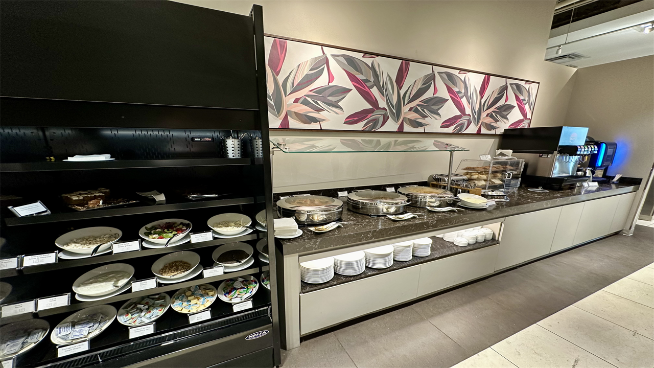 a buffet with food on shelves at the Desjardins Odyssey Lounge