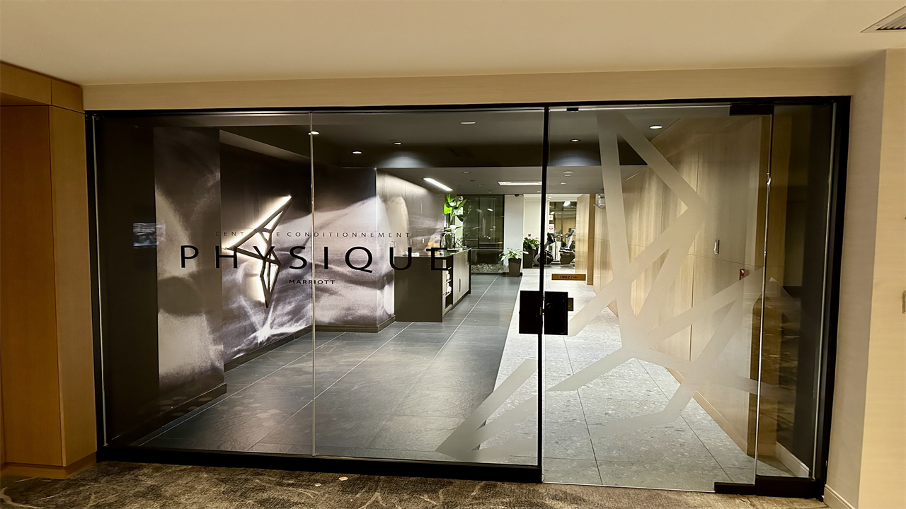 a glass door with a logo on it